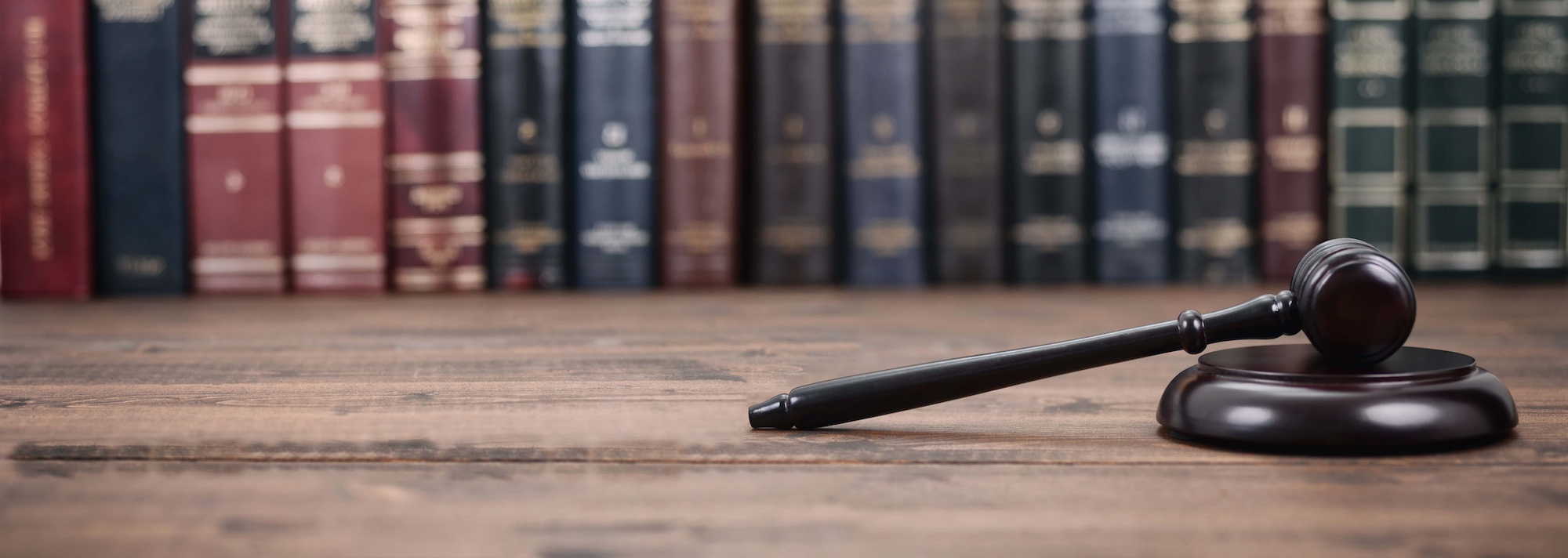 Judge Gavel and Law books on a wooden background