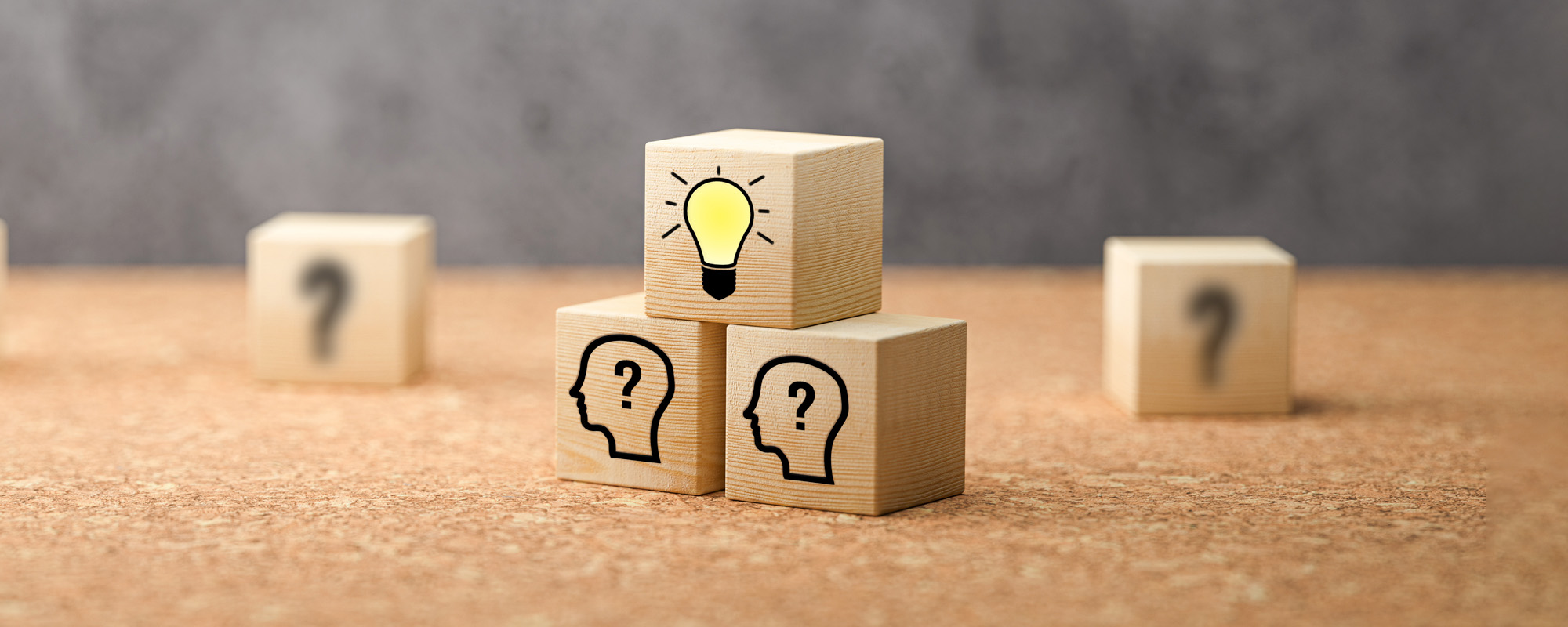 cubes showing a brainstorming session on concrete background