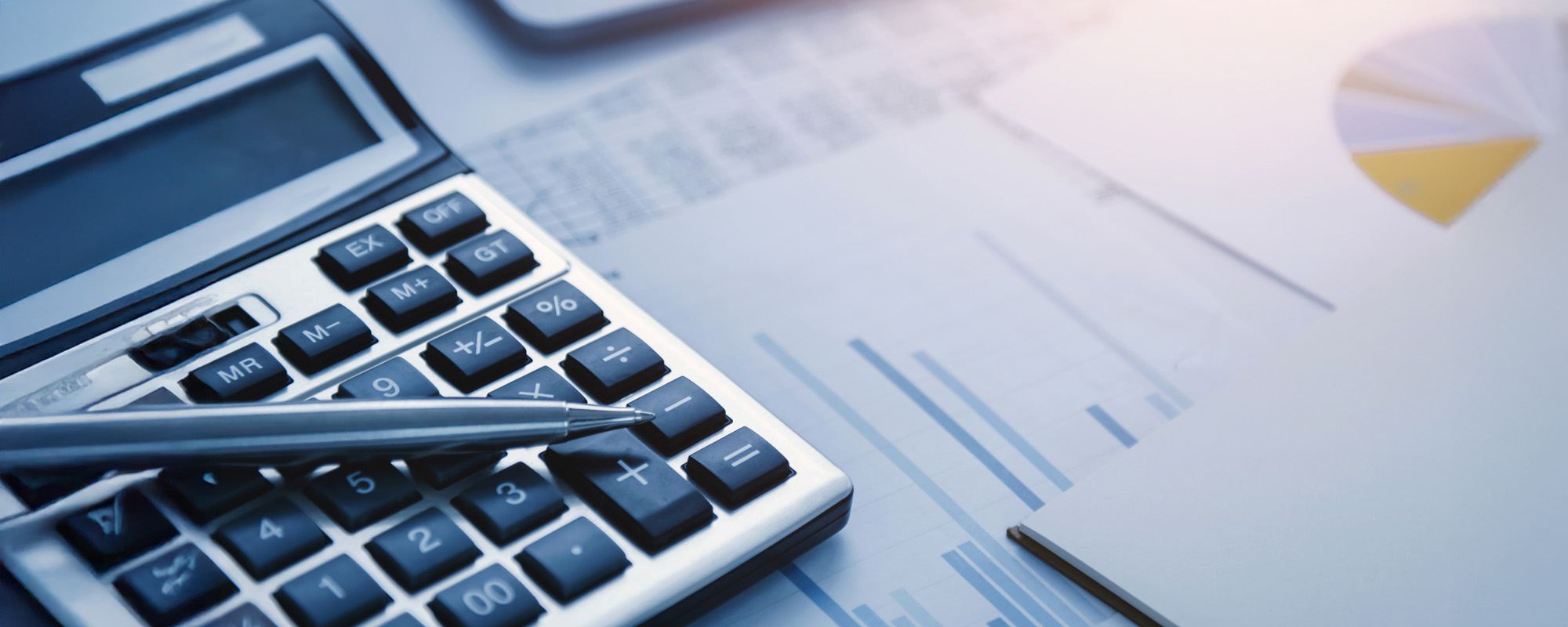 pen and calculator on table