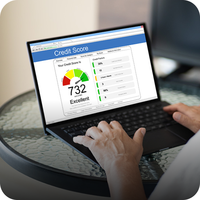 person checking their credit score on a laptop