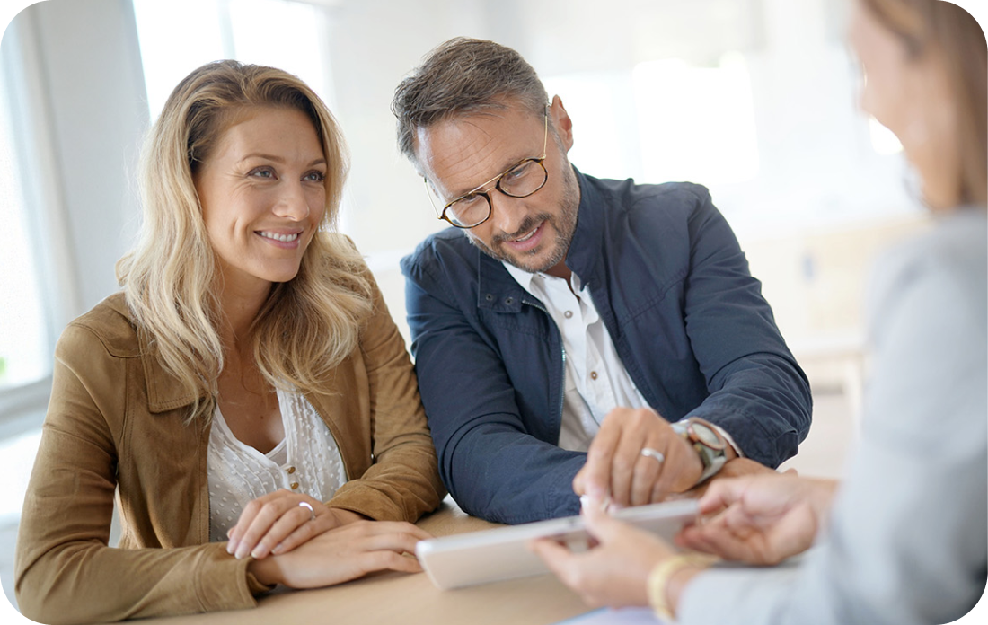 man and woman speaking with a lawyer