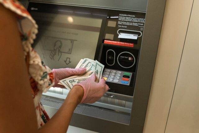 person withdrawing money from an atm